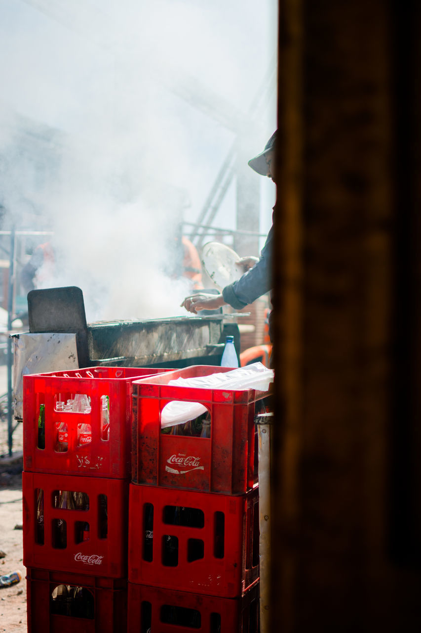 MAN WORKING ON RED STRUCTURE