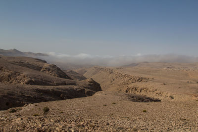 Scenic view of desert against sky