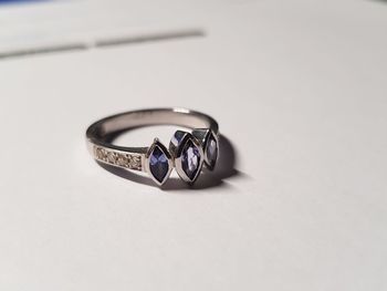 Close-up of wedding rings on table