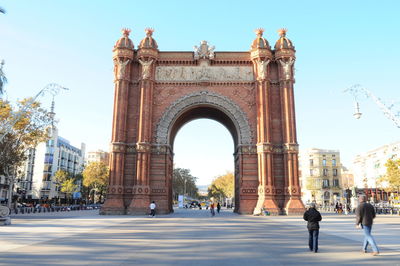 People in front of historical building