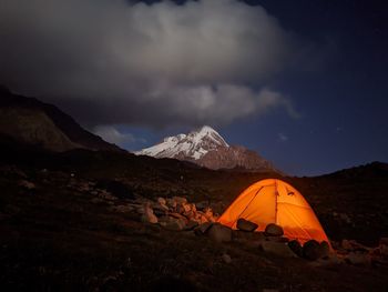 Scenic view of mountains against cloudy sky