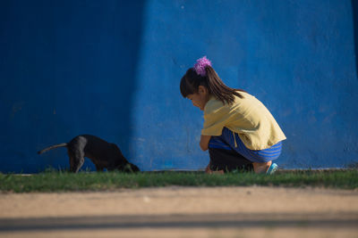 Side view of girl wearing hat