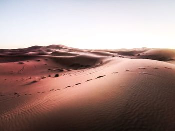 Scenic view of desert against clear sky