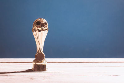 Close-up of light bulb on table