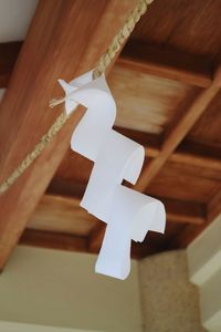 Low angle view of paper hanging on rope