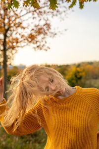 Portrait of woman wearing hat against sky