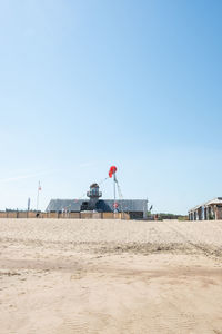 Scenic view of beach against clear sky