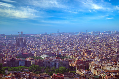 High angle view of illuminated city buildings against sky