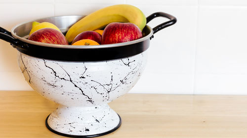 Close-up of fruits in bowl on table