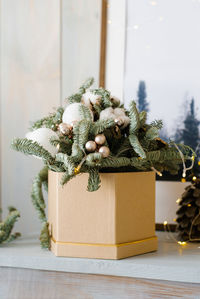 Fir branches and christmas balls in a box. christmas fir composition