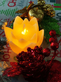 Close-up of yellow rose on table