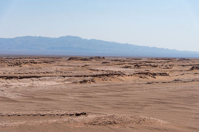 Scenic view of desert against clear sky