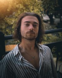 Portrait of young man standing outdoors