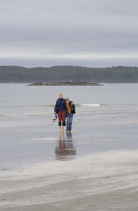 View of man and woman at beach