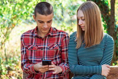 Young woman using mobile phone