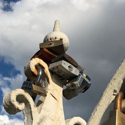 Low angle view of metal structure against sky