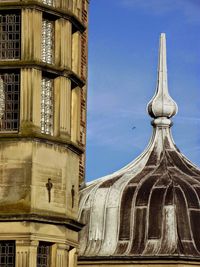 Low angle view of building against blue sky