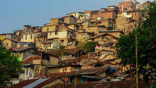 Houses in town against clear sky