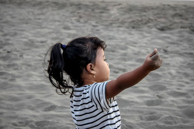 Rear view of girl on beach