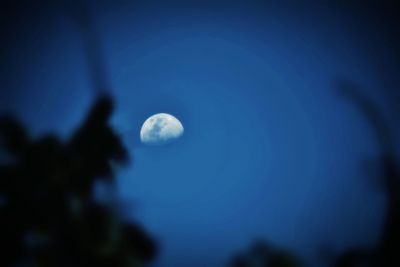 Low angle view of moon against the sky