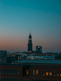 Illuminated buildings in city at night