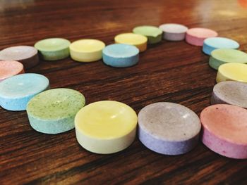 Close-up of heart shape made with colorful candies on table