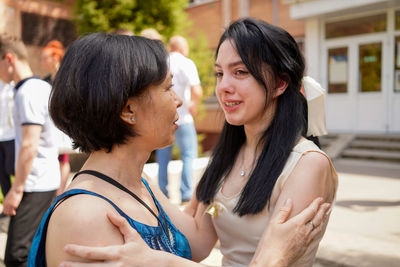 Portrait of mom and daughter smiling