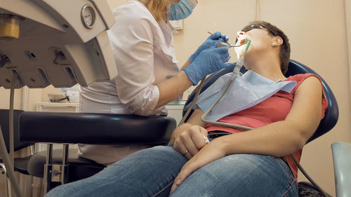 Dentist examining patient