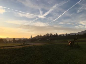 Scenic view of field against sky during sunset