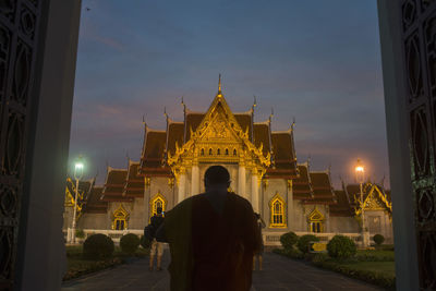 View of illuminated temple at night