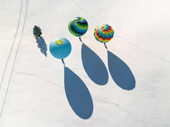 Low angle view of balloons against sky