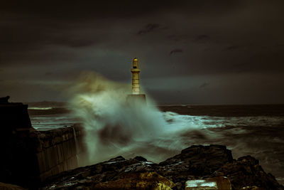 Scenic view of sea against cloudy sky