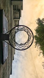 Low angle view of basketball hoop against sky