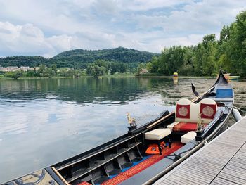 Scenic view of a gonfola in a lake against sky 