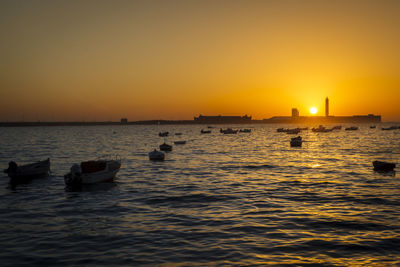 Scenic view of sea against clear sky during sunset