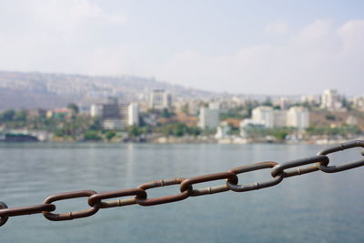 Close-up of chain against sky in the holy sea of galilee 