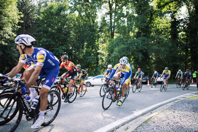 People riding bicycle on road