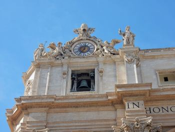 Low angle view of statue against building