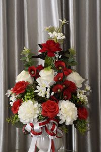 Close-up of red flowers in vase