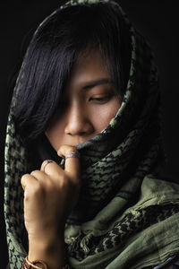 Close-up of woman wearing headscarf