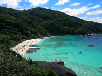 Scenic view of sea and mountains against sky