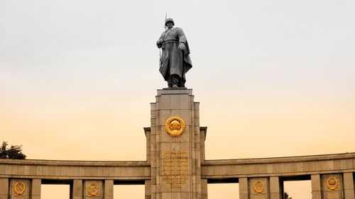 Low angle view of statue of tower against sky