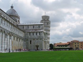 Low angle view of historical building against cloudy sky