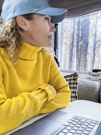 Young woman using laptop at home