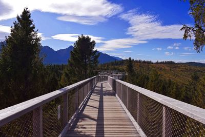 Footbridge against sky