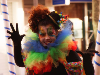 Portrait of happy mid adult woman in face paint standing outdoors