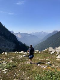 Rear view of man walking on mountain