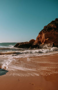Scenic view of sea against clear blue sky