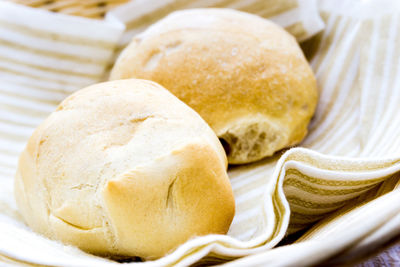 Close-up of buns with napkin in basket