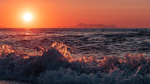 Scenic view of sea against sky during sunset